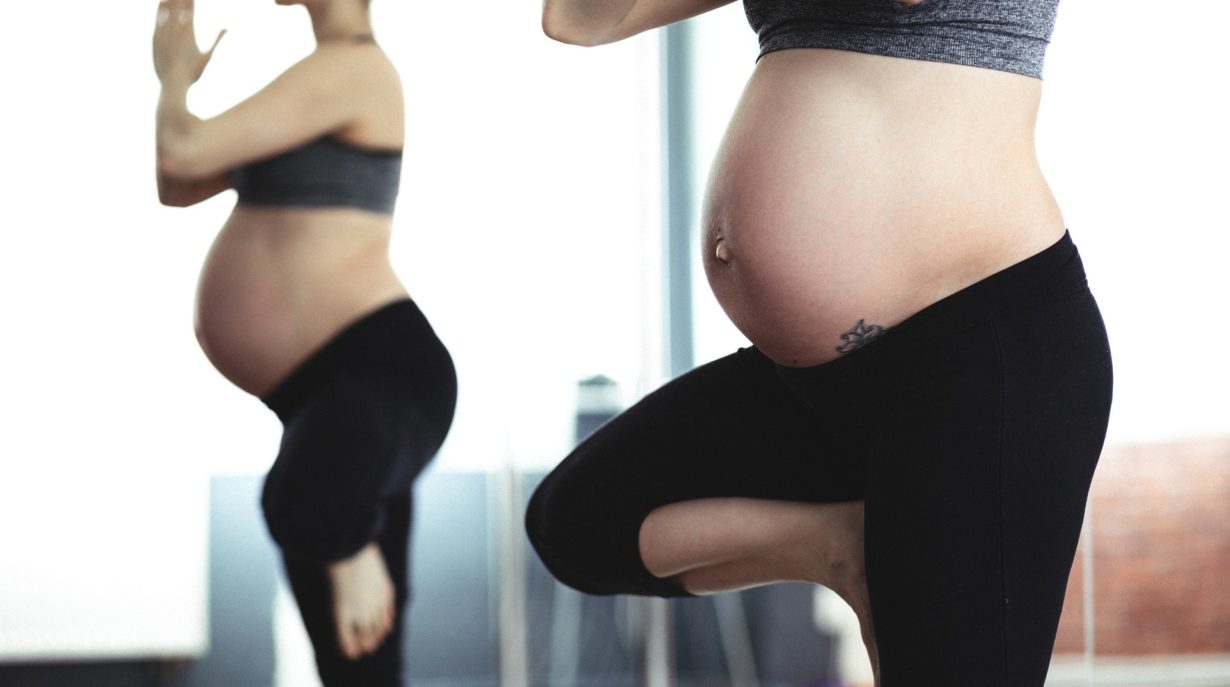 pregnant women exercising doing pilates